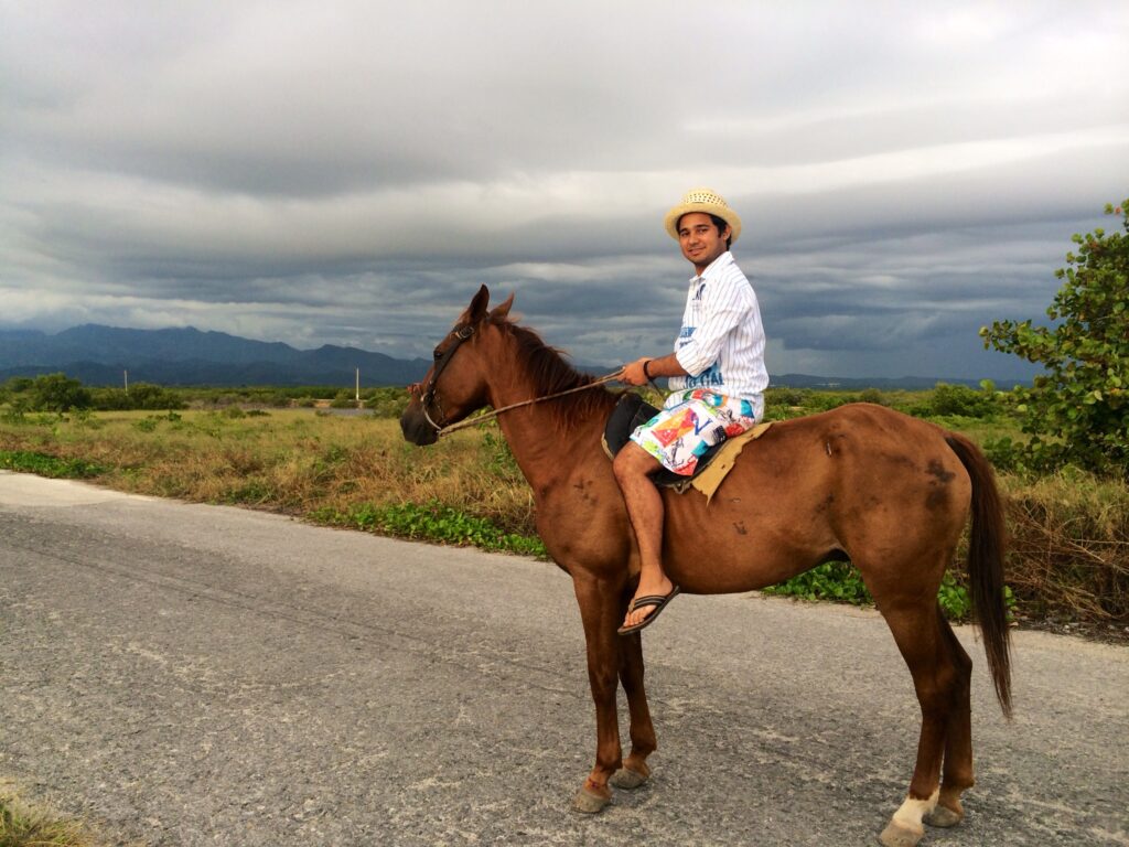 Karim Mohammadi on a horse on top of a hill