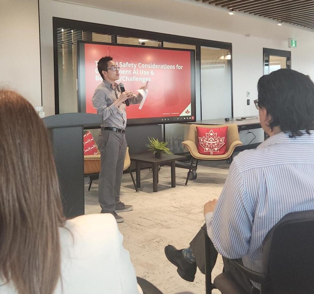 Kevin Nguyen speaking at a conference in front of a screen